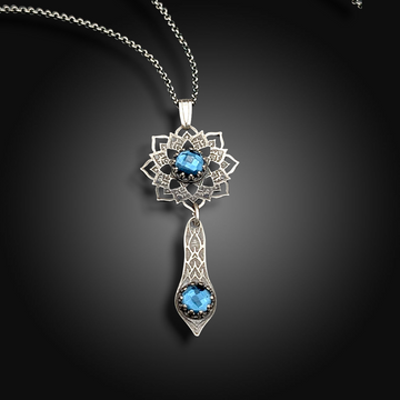 ECHO OF THE DEEP: Hand-Etched Sterling Silver Necklace with Blue Topaz