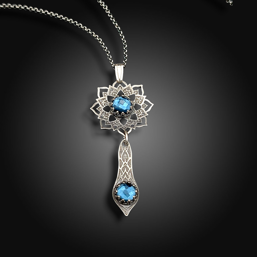 ECHO OF THE DEEP: Hand-Etched Sterling Silver Necklace with Blue Topaz